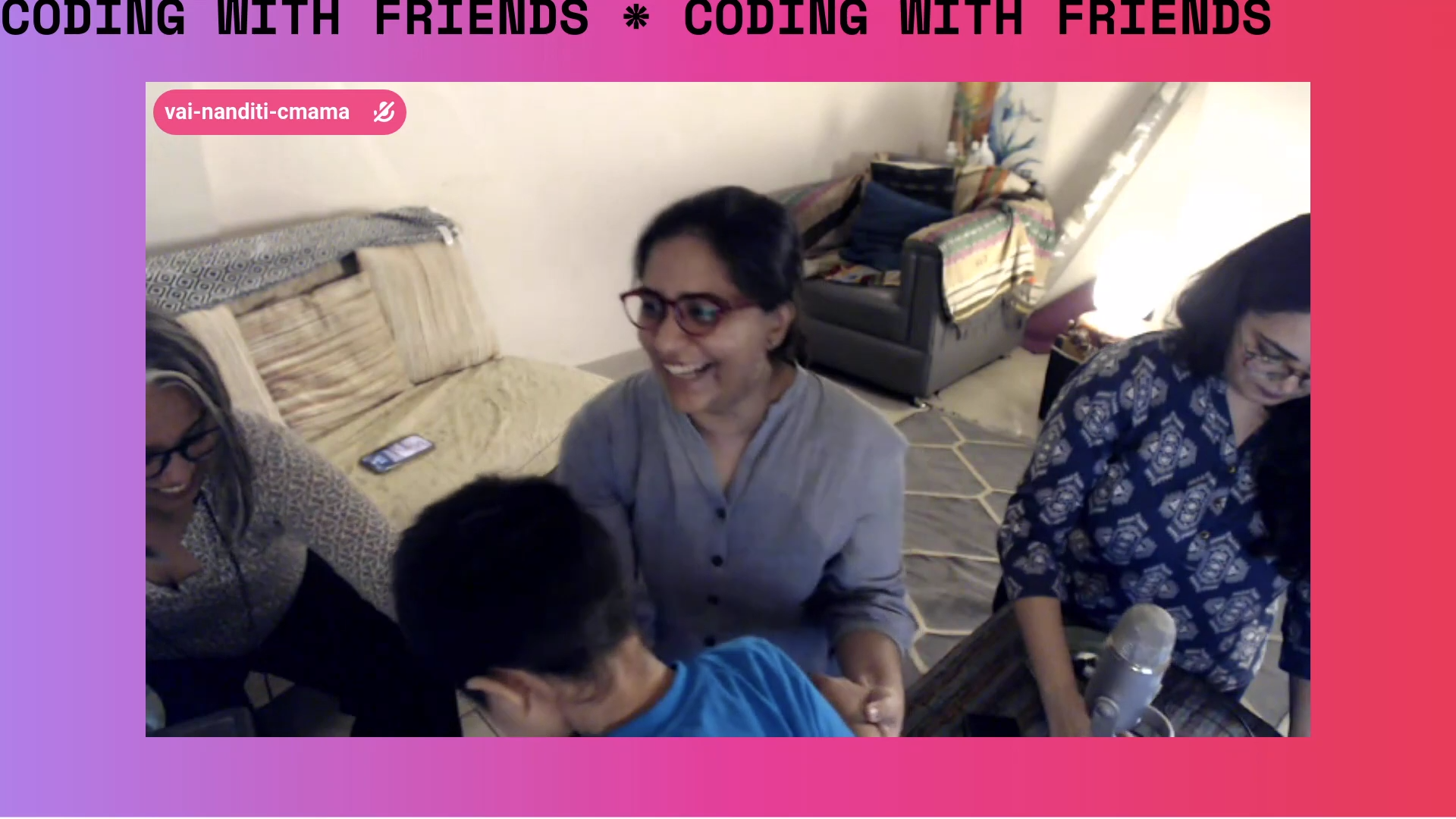 A screenshot showing three women smiling while the back of a young child appears in the centre of the image. The image appears over a pink and purple background.